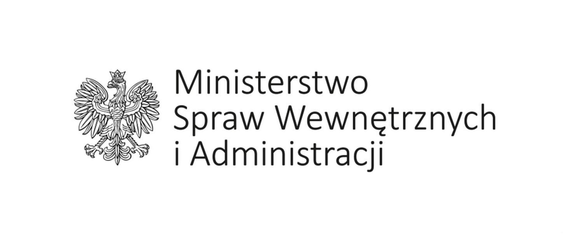 Ilustracja przestawia na białym tle , z lewej strony czarno biały orzeł oraz napis umieszczony po prawej stronie o treści Ministerstwo Spraw Wewnętrznych i Administracji 