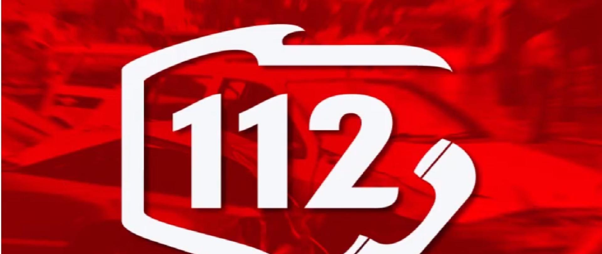 Grafika przedstawia numer alarmowy 112 na czerwonym tle wpisany w kszta艂t zarys granic Polski
