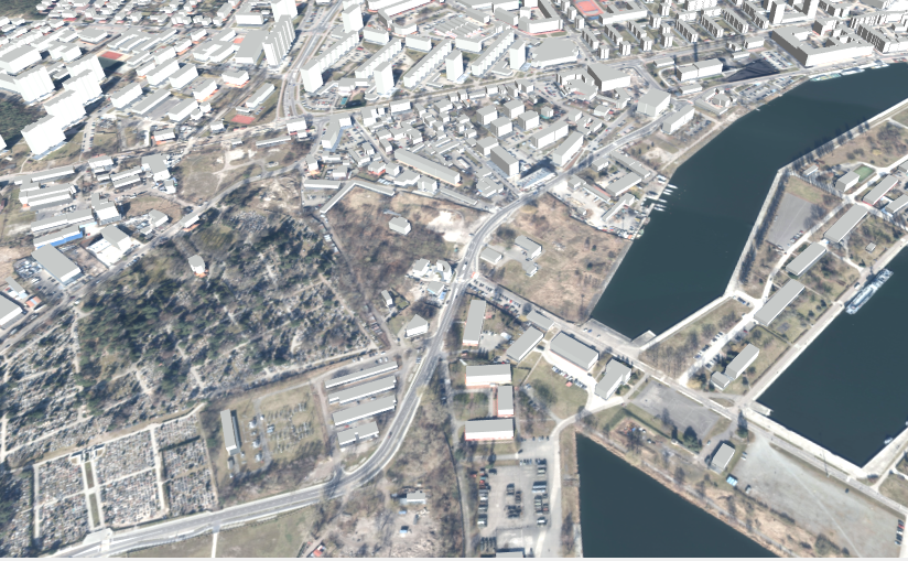 Rys. 1 - przedstawia zrzut ekranu prezentujący modele 3D budynkow w standardzie LoD1 dla obszaru m. Gdańsk na tle ortofotomapy