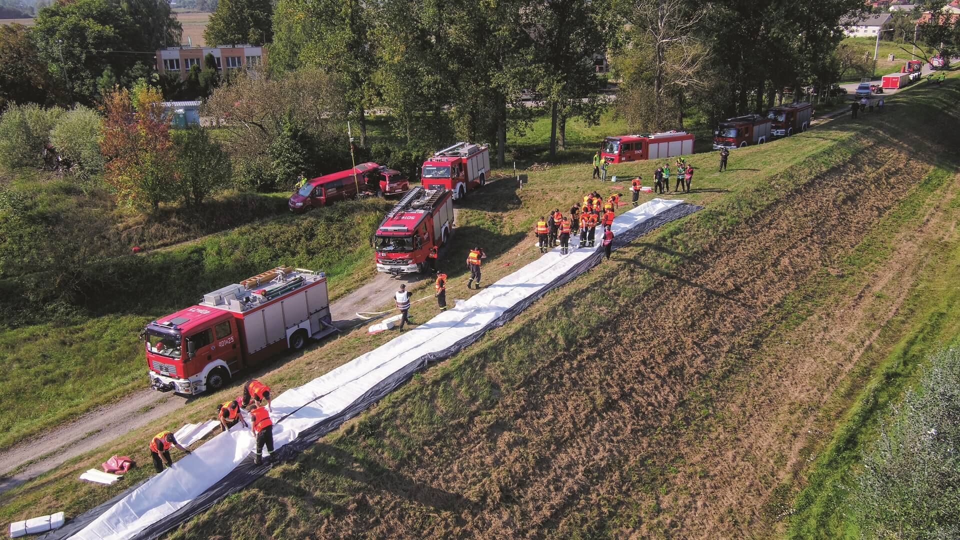 Fire maneuvers at the embankment of the river, numerous fire trucks and officers