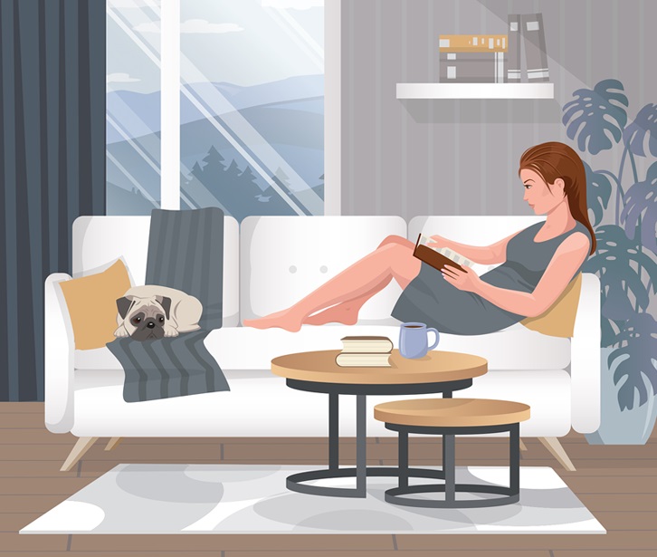 kobieta czyta książkę w domu 