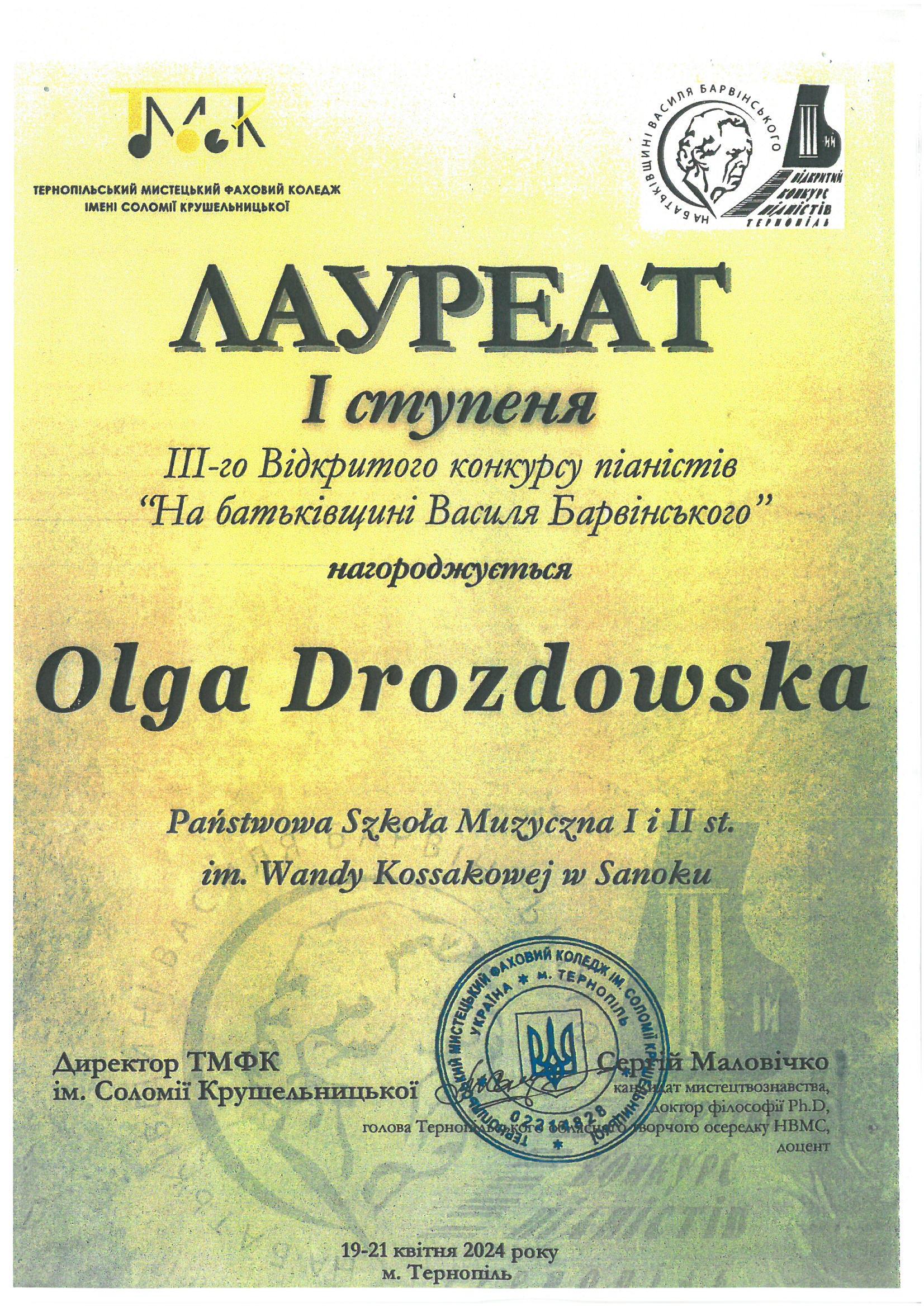 Dyplom - Olga Drozdowska - Tarnopol 19-21.04.2024r. Żółte tło, czarne litery, w górnym rogu logo konkursu 