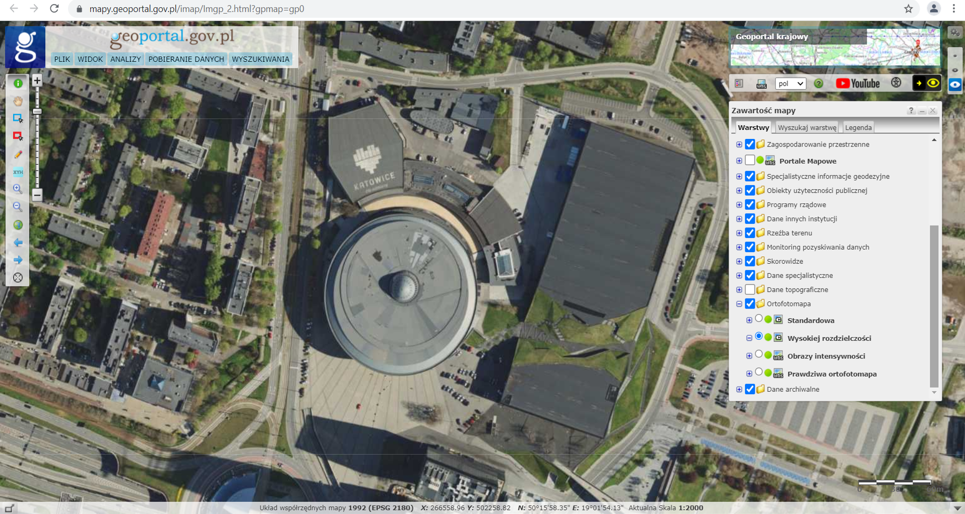 Ilustracja przedstawia zrzut ekranu z serwisu www.geoportal.gov.pl przedstawiający Ortofotomapę Wysokiej Rozdzielczości dla miasta Katowic