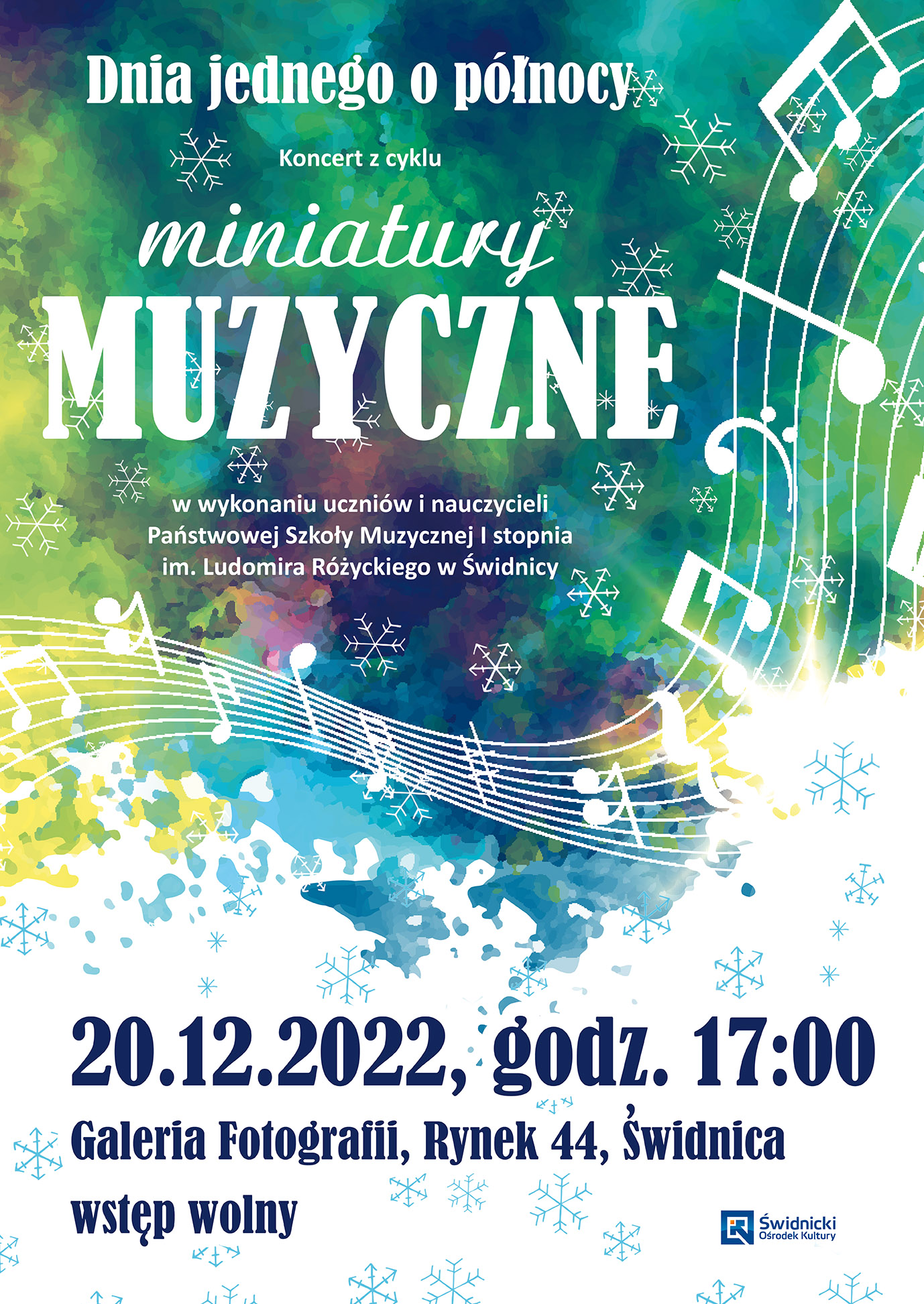 Plakat przestawia kolorowe tło żółto, zielone, niebieskie, białe z imitacją płatków śniegu, na tym tle w połowie plakatu przechodzi wstążka w kształcie pięciolini z nutami . Tytuł plakatu to białe litery. U dołu tekst w kolorze czarnym informujący o dacie godzinie i miejscu koncertu.