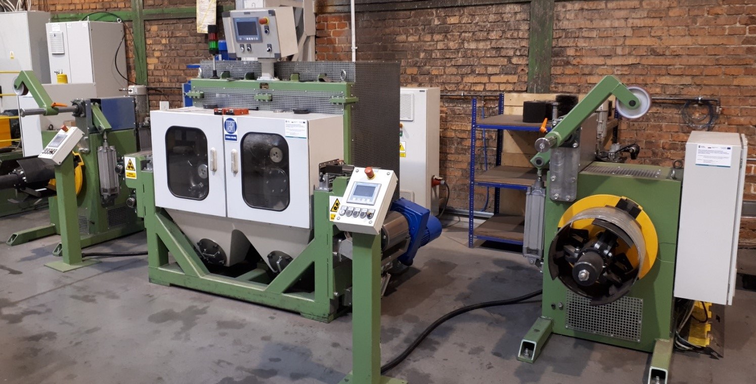 Fig.3_ The strip grinder with uncoiling and recoiling system.