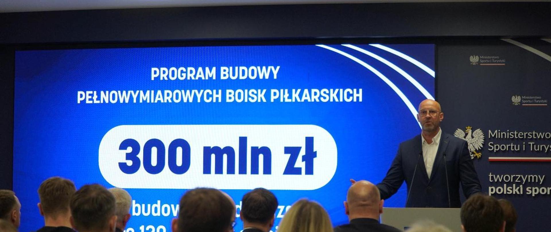 Minister of Sport and Tourism Jakub Rutnicki delivers a speech during a press conference.