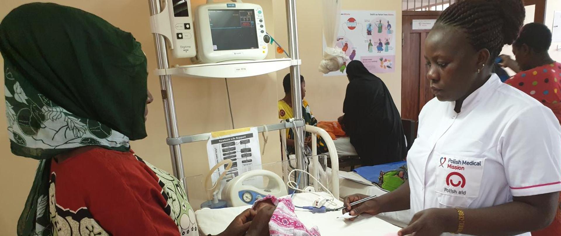 The Nurse is taking care of mother with child.