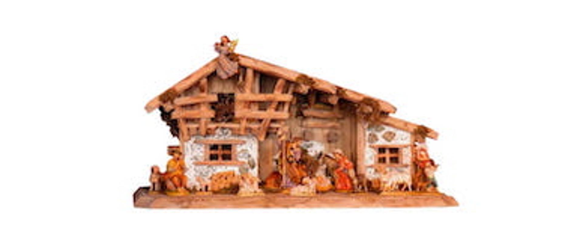 Życzenia świąteczne. Na jasnym tle czarny tekst. Na dole grafika - szopka.