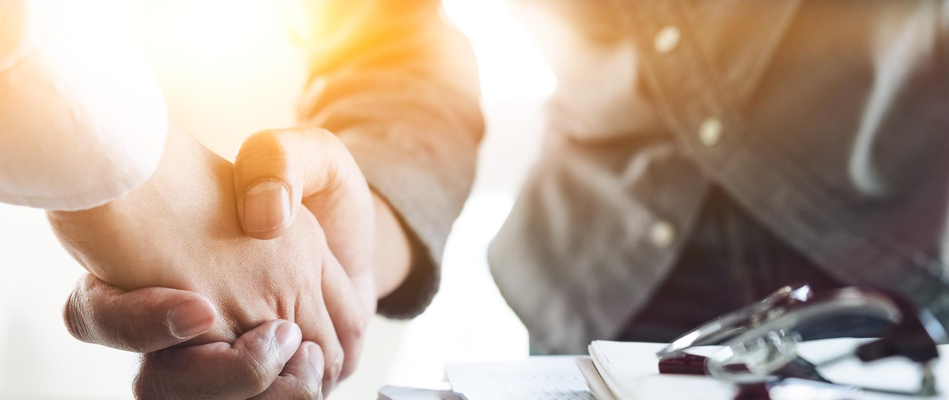 Close up of Business people shaking hands, finishing up meeting, business etiquette, congratulation, merger and acquisition concept