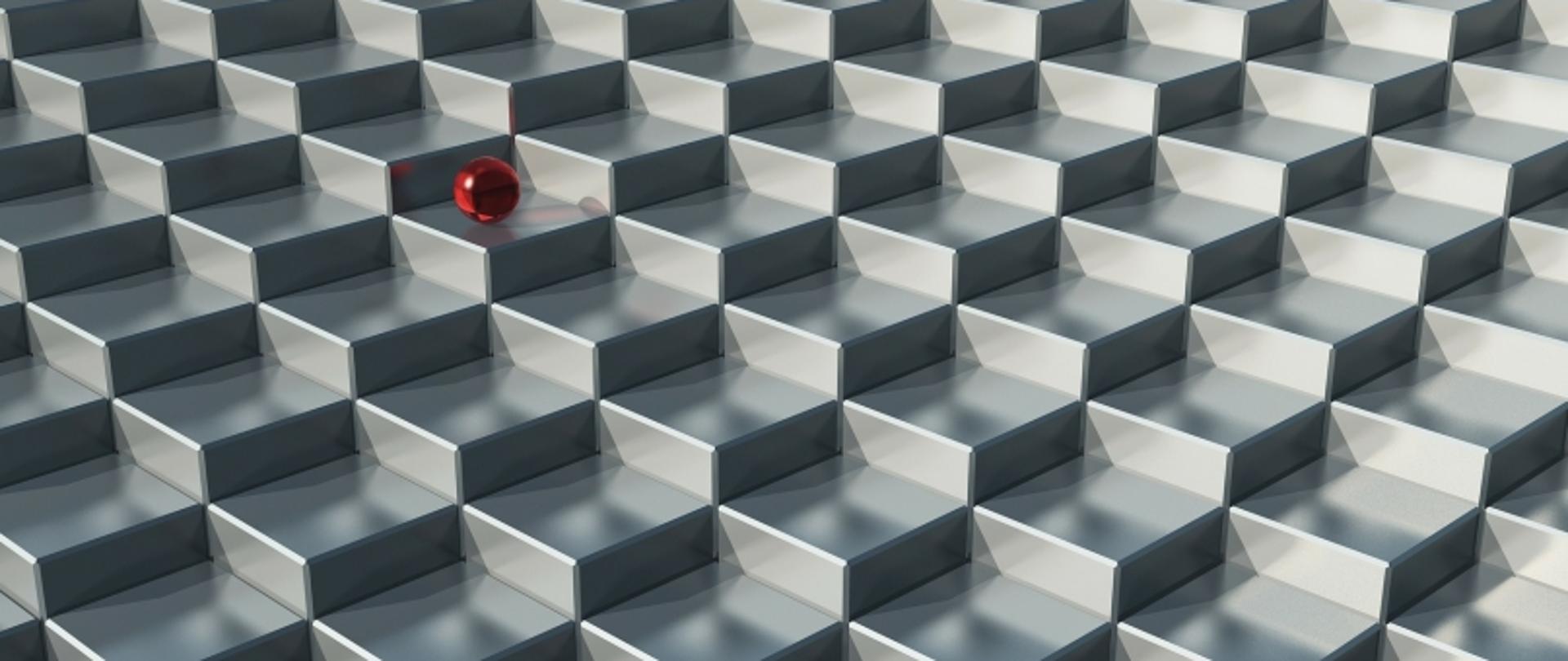 Siatka trójwymiarowych, metalicznych sześcianów z czerwoną kulą umieszczoną w górnej lewej części obrazu.