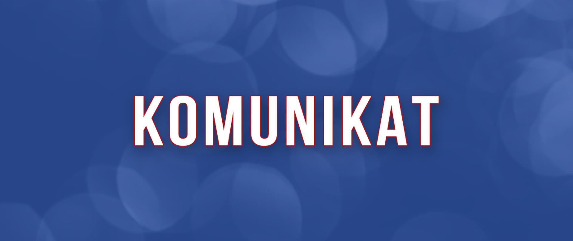 Napis Komunikat na niebieskim tle