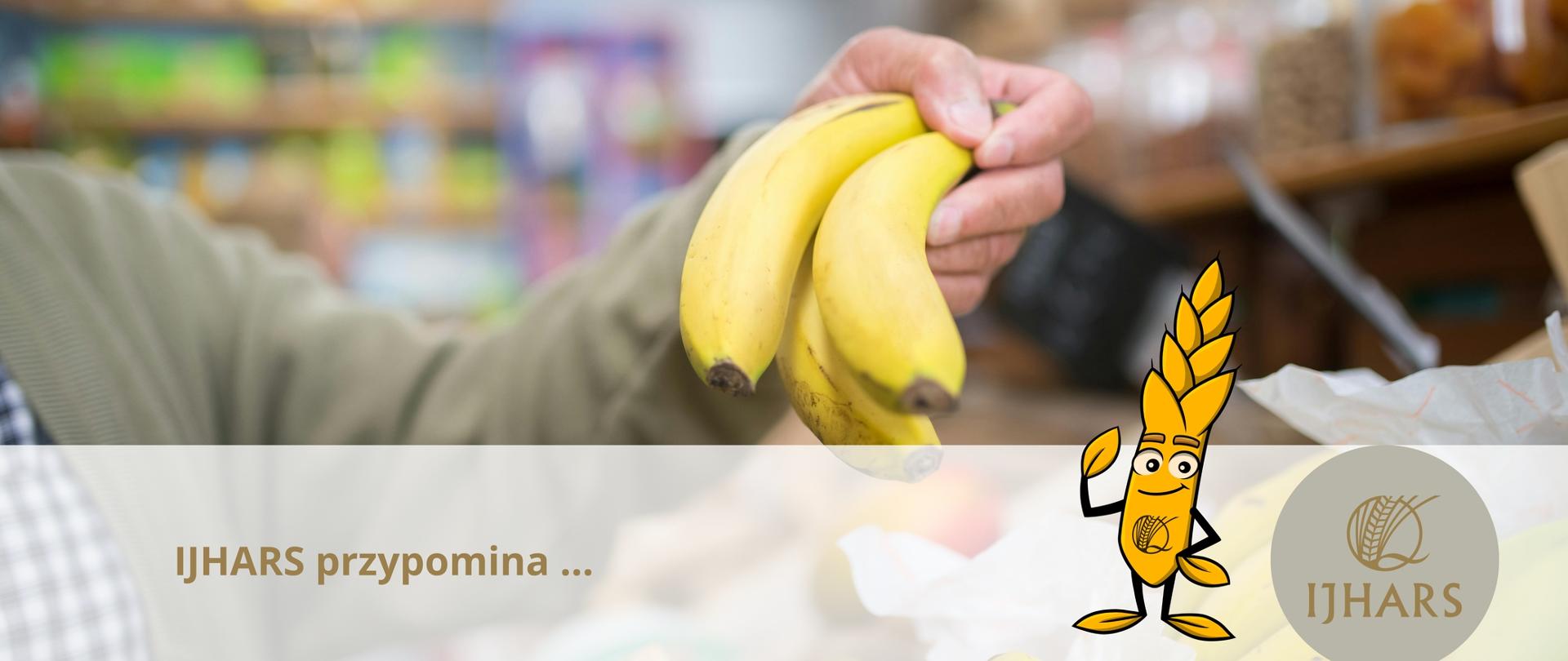 Zdjęcie przedstawia rękę trzymającą kiść bananów, napis IJHARS przypomina i logo IJHARS wraz z wizerunkiem maskotki w postaci kłosa.