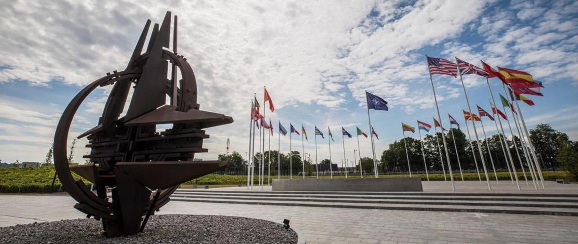 Compass rose and flags in front of NATO HQ