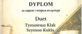 Dyplom dla Duetu Tymoteusz Kłak i Szymon Kukla za zajęcie I miejsca w II Ogólnopolskim Konkursie Muzyki Kameralnej „Młodzi Kameraliści”. Uczniowie zostali przygotowani przez P. Nowaka z ZPSM im. F. Chopina w Jarosławiu. Dyplom ma tło z grafiką saksofonu, skrzypiec i fortepianu. Pruszków, 27-28 kwietnia 2026 r.