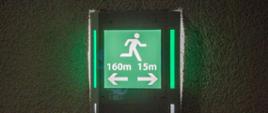 Znak określający odległość do przejścia ewakuacyjnego