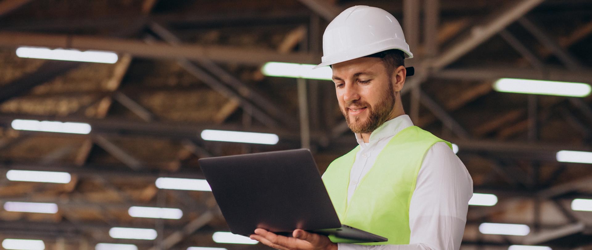 Young man engineer working on factory