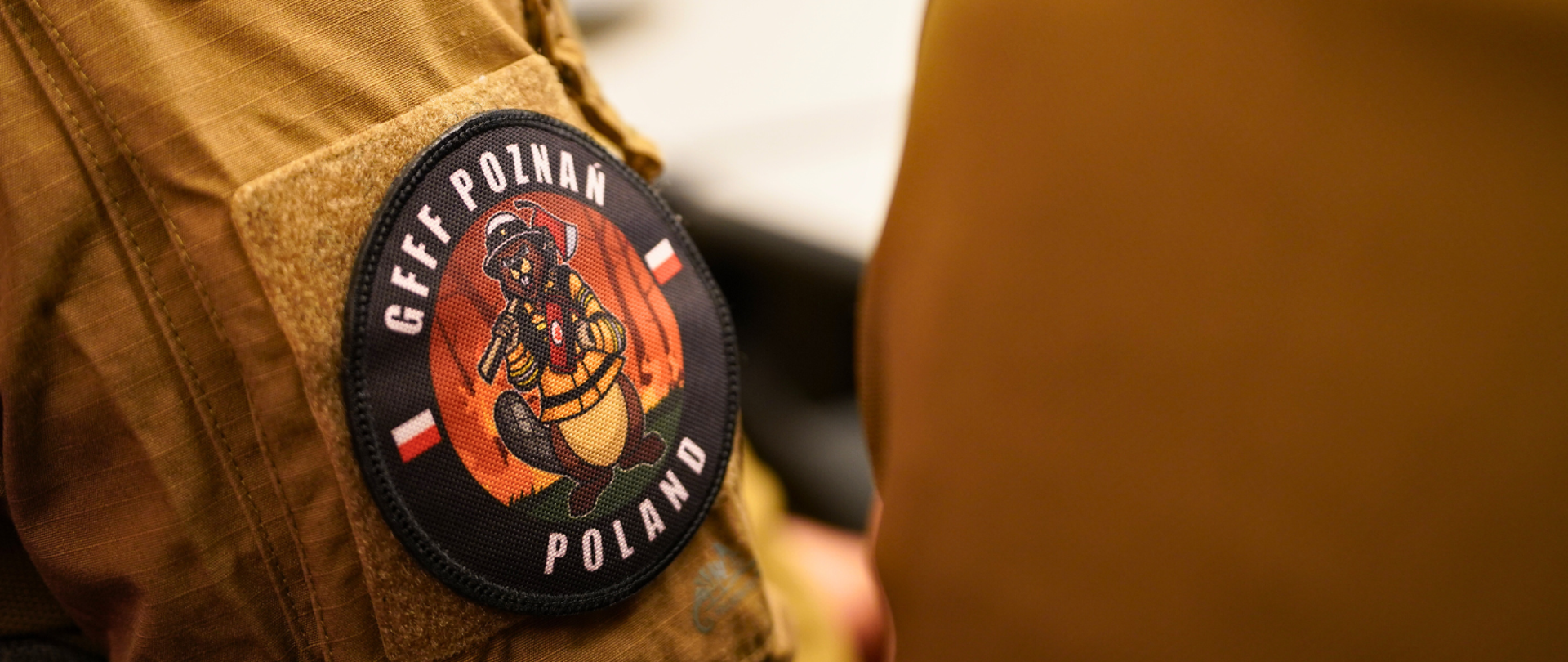 Strażak prowadzi prelekcję na temat podsumowania i planów działalności modułu na kolejny rok