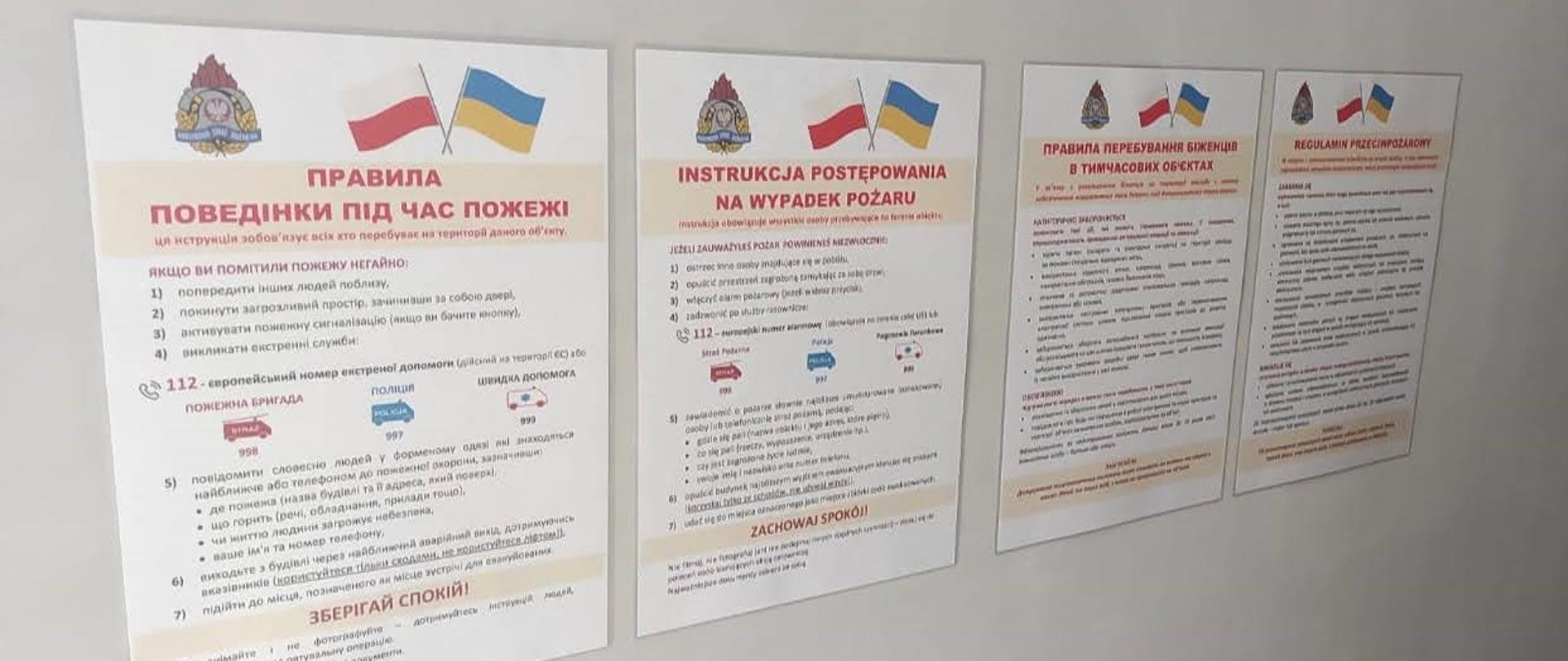 Na zdjęciu znajdują się instrukcje alarmowania po Ukraińsku oraz regulamin przeciwpożarowy również po Ukraińsku.