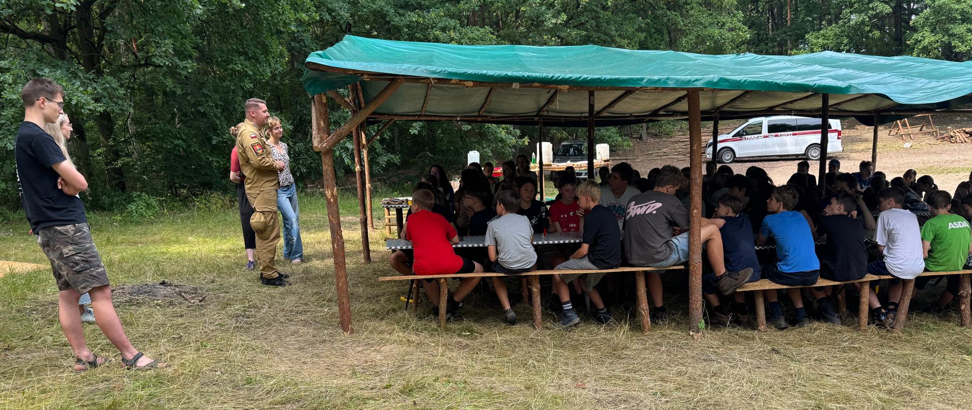 Wizytacja obozów harcerskich na terenie powiatu lipnowskiego 2026, omówiono organizację warunków ewakuacji w sytuacji zagrożenia oraz zaznajomiono uczestników obozu z prawidłowym zachowaniem się podczas burzy
i wypoczynku nad wodą. 