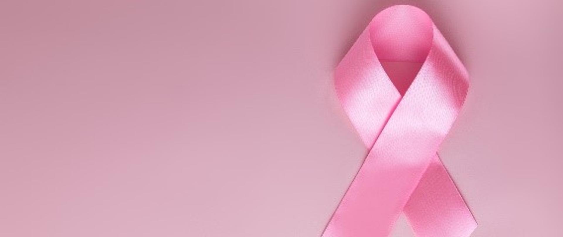 Dzień Walki z Rakiem Piersi, różowa wstążka na jednolitym tle.
