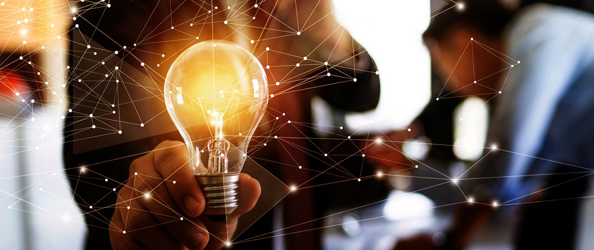 Innovation and idea of professional leader holding lighting bulb, business people planing and analysis work on table in office, brainstorming teamwork and thinking management concept