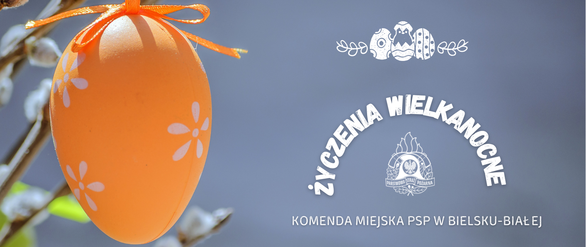 Na grafice pomarańczowa pisana z życzeniami KM PSP w Bielsku-Białej