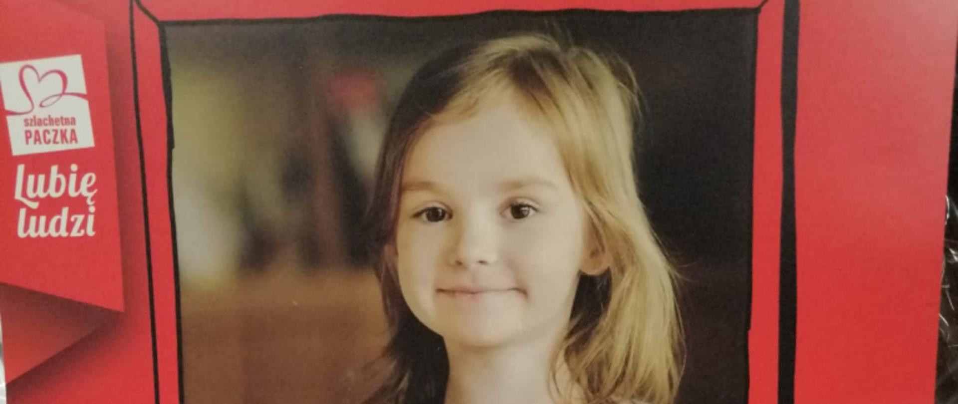 Plakat Szlachetnej paczki, dziewczynka z kartą z napisem Dziękuję