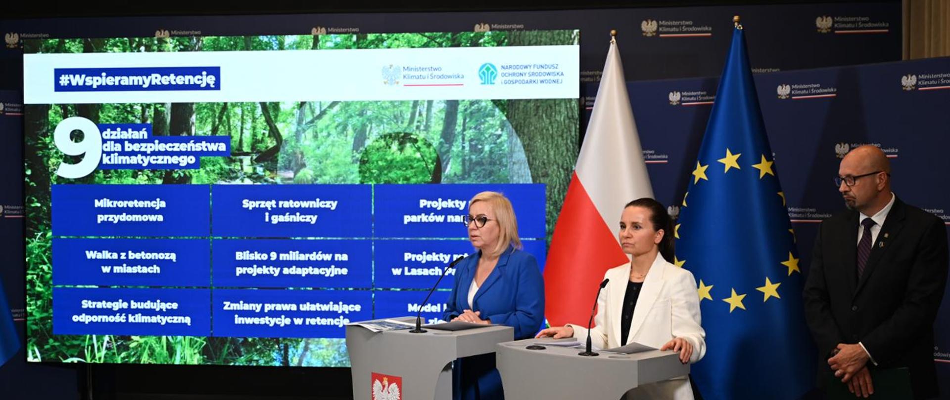 Minister of Climate and Environment Paulina Hennig-Kloska, Deputy Minister Urszula Zielińska and Robert Gajda, Deputy President of the Management Board of the National Fund for Environmental Protection and Water Management (NFEP&WM), during a press conference on the package of nine measures to strengthen Poland’s climate security, held in Warsaw on 24 June 2026. The Minister and the Deputy Minister are standing at two lecterns, while the Deputy President stands beside them. Behind them, a screen displays the nine measures for climate security. The flags of Poland and the European Union are visible nearby.
