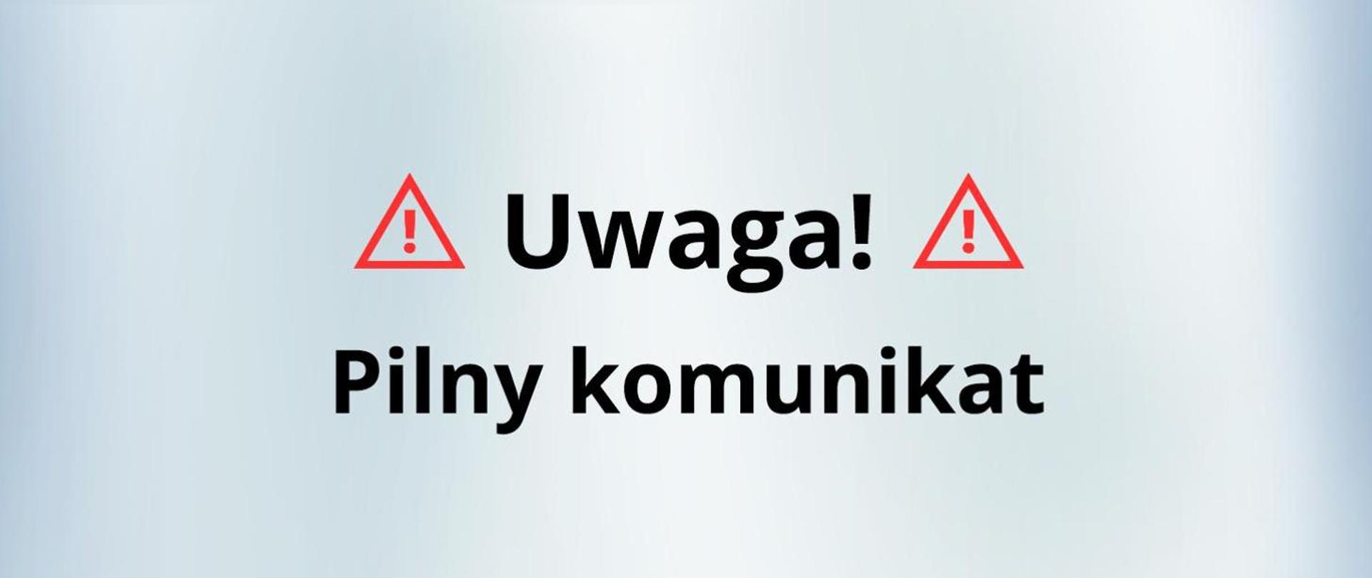 Grafika przedstawiająca napis "Uwaga. Pilny Komunikat" opatrzona dwoma czerwonymi trójkątami ostrzegawczymi