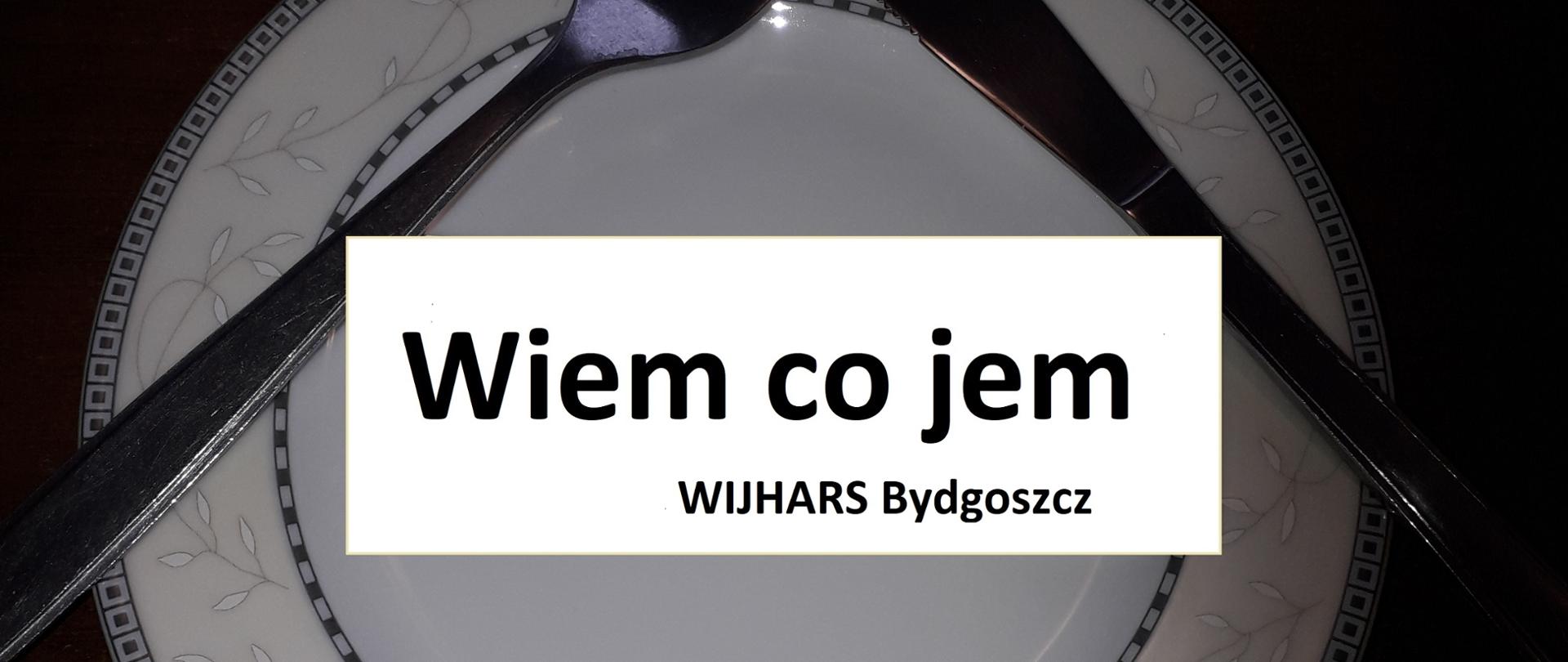 Zdjęcie przedstawia talerz z widelcem i nożem oraz napisem "wiem co jem orz WIJHARS Bydgoszcz"