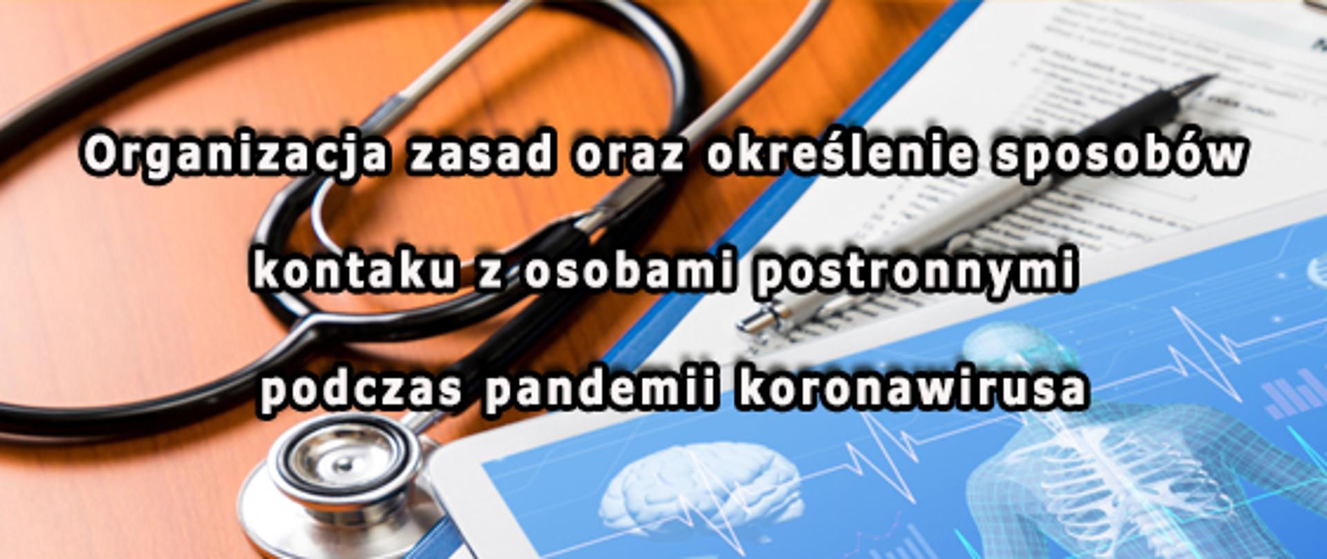 fotografia przedstawia widok biurka na którym leży stetoskop medyczny, karta medyczna z historią pacjenta, długopis oraz folder medyczny.