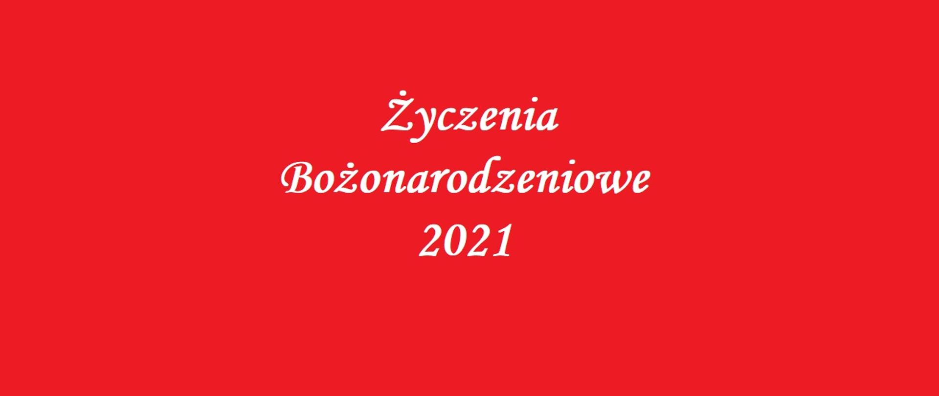 Na czerwonym tle biały napis Życzenia Bożonarodzeniowe 2021