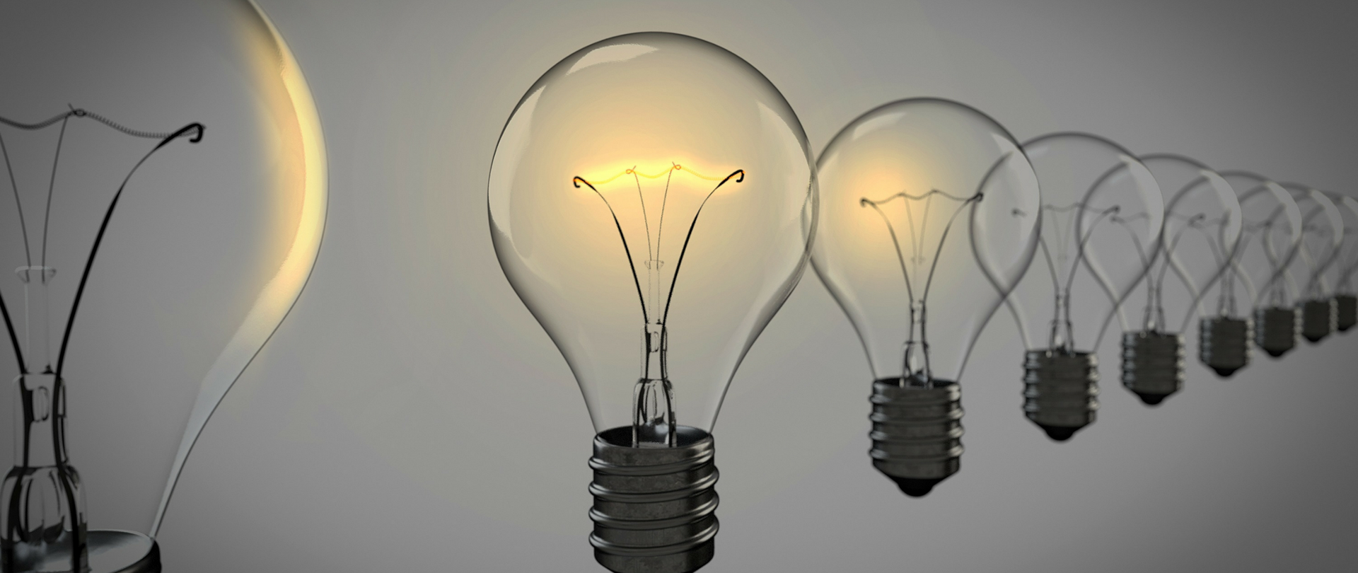 Ilustracja przedstawiająca zapaloną żarówkę