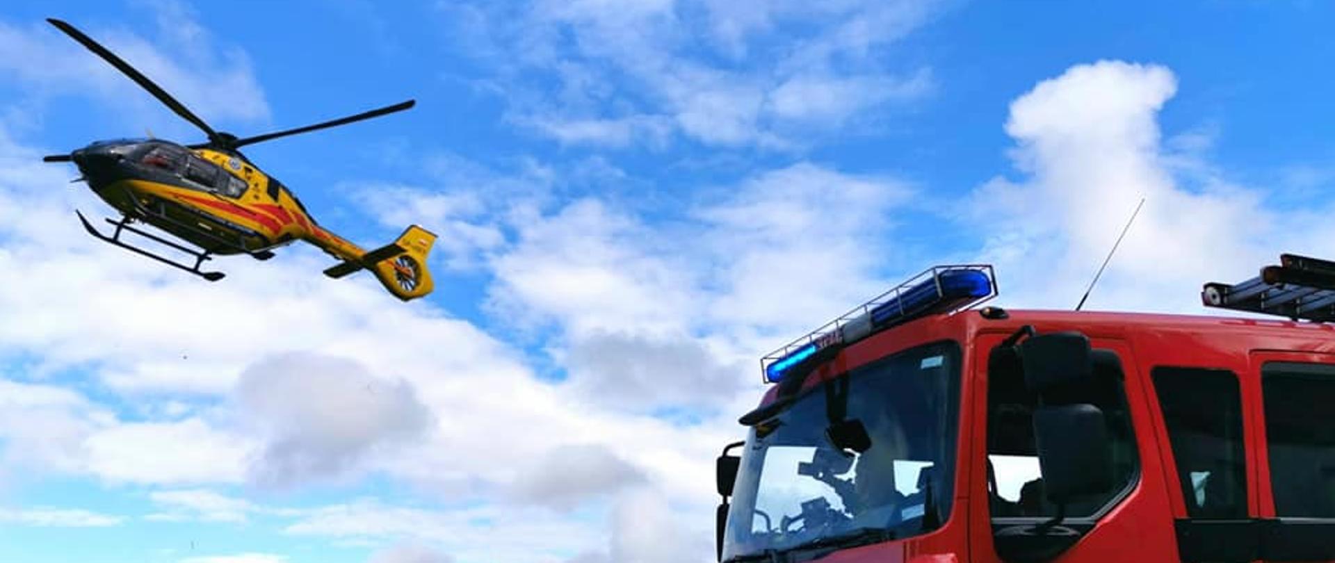 Zdjęcie przedstawia samochód bojowy wraz z LPR, uczestniczące w akcji ratowniczej. 