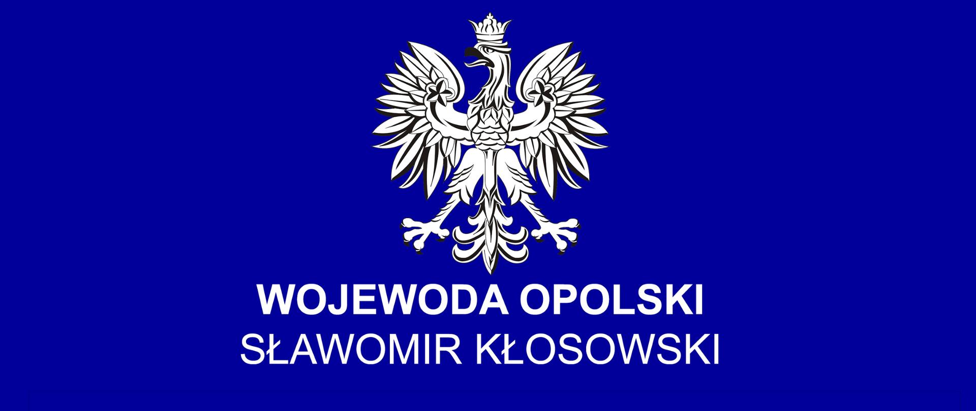 Grafika z granatowym tłem. Na niej u góry widać godło z napisem Wojewoda Opolski Sławomir Kłosowski. Poniżej na czerwono wielkimi literami napis: OŚWIADCZENIE