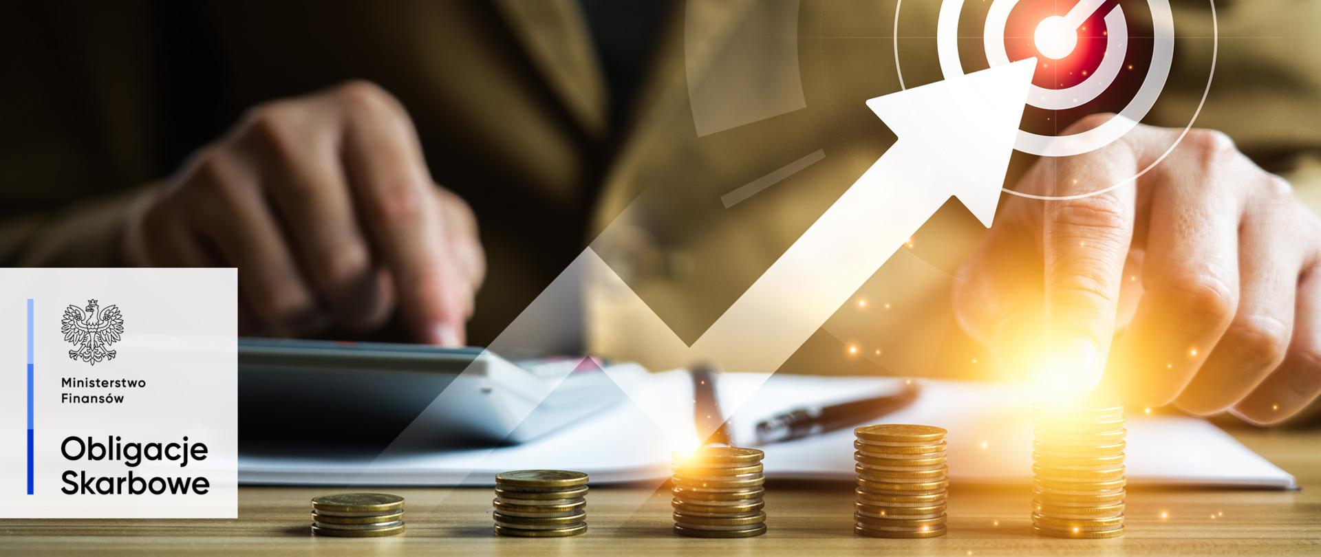 Dłonie, kalkulator, dokumenty, strzałka wykresu skierowana do góry. Ministerstwo Finansów, Obligacje Skarbowe.