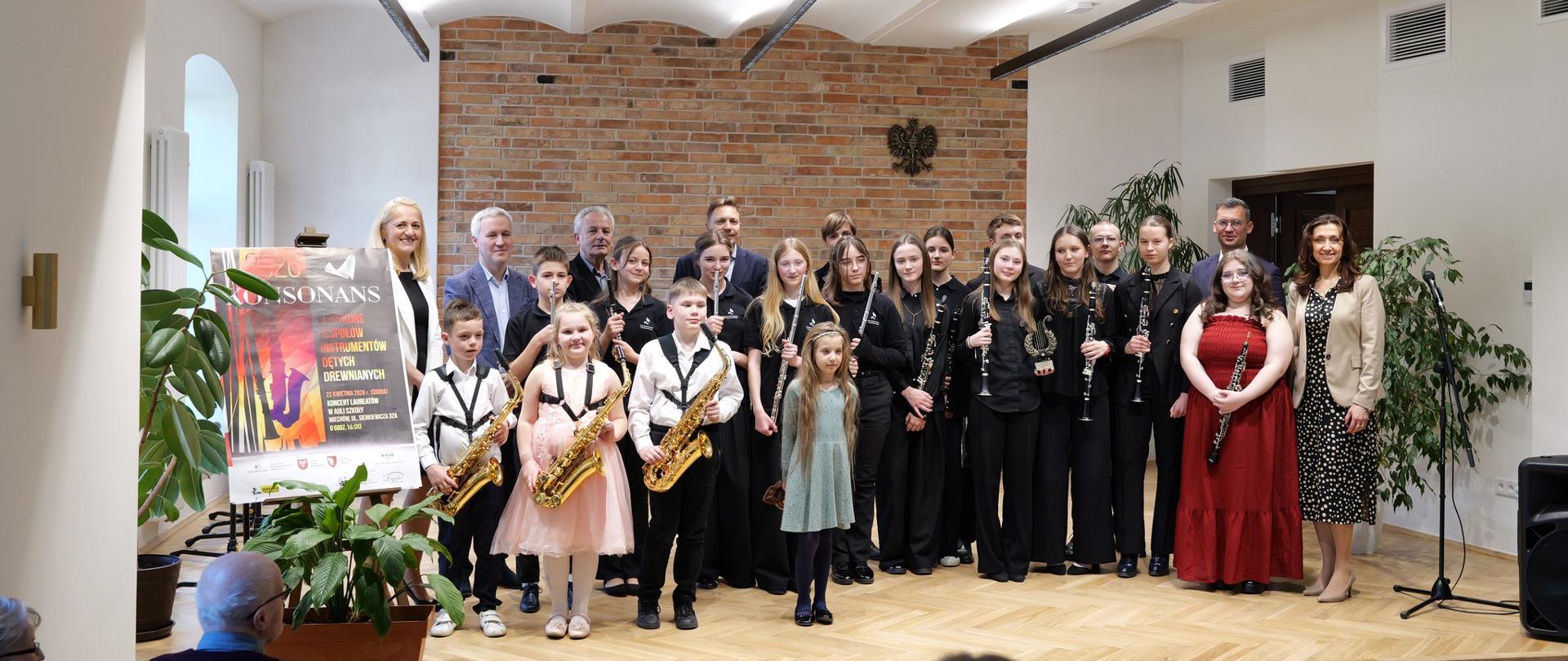 Konkurs KONSONANS 2026 – jury, występy zespołów instrumentów dętych drewnianych oraz uczestnicy podczas wydarzenia muzycznego