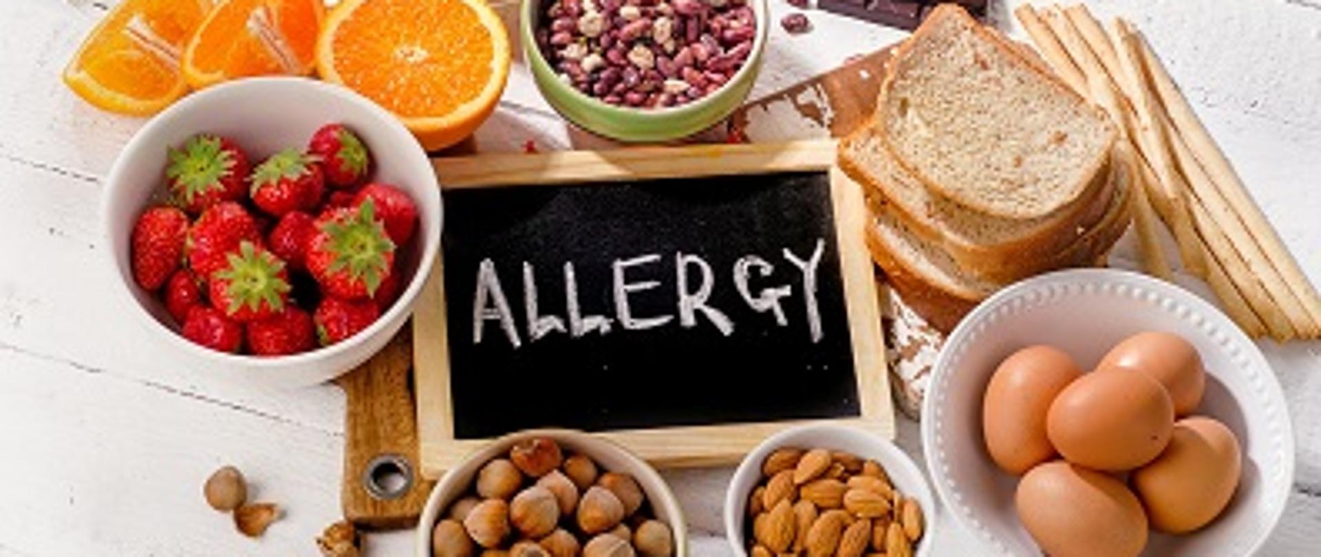 Food allergy. Allergic food on wooden background. View from above