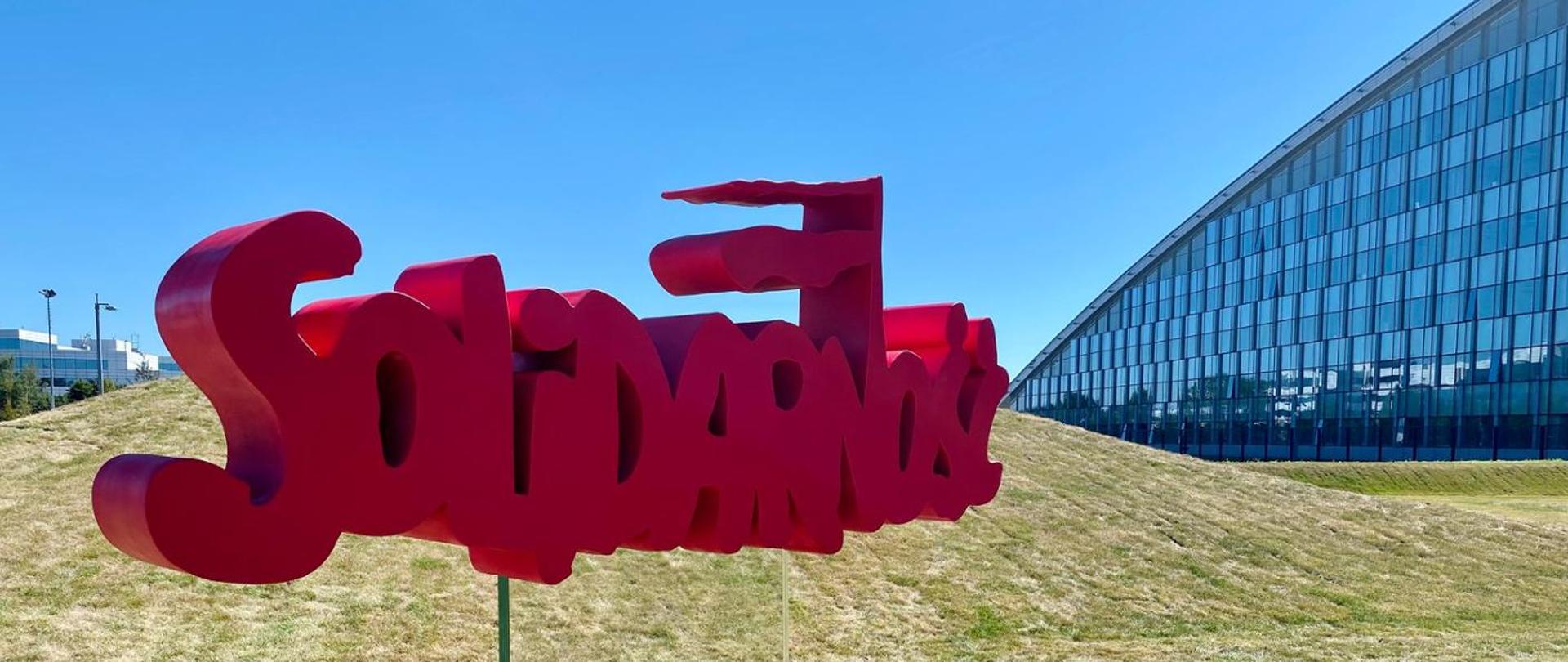 Solidarity logo in front of NATO HQ