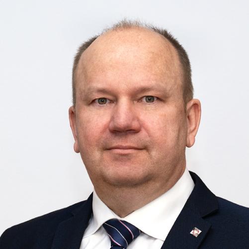 Członek Rady - Pan Włodzimierz Paterka - na szarym tle w garniturze