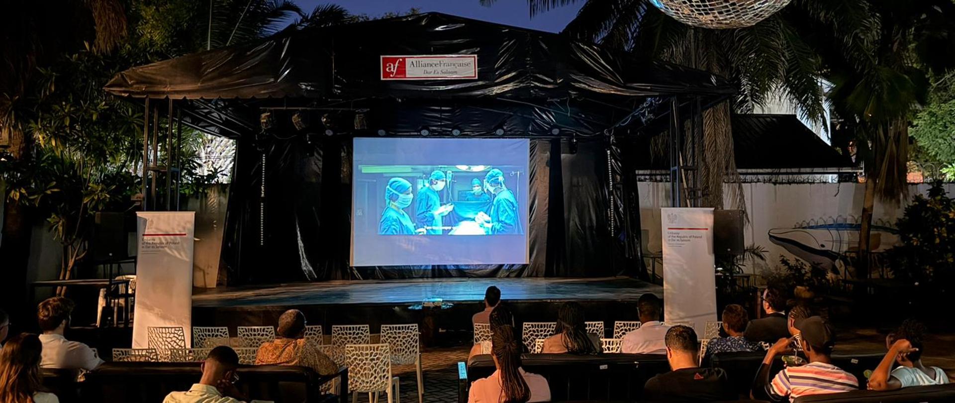 The picture of the audience and the venue during the screening of the movie Gods