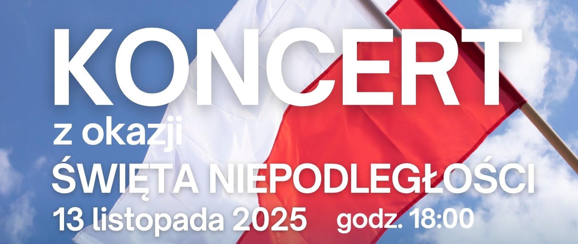 Na banerze reklamowym znajduje się flaga Polski wraz z informacjami dotyczącymi koncertu z okazji Dnia NIepodległości w dniu 13 listopada 2025r.