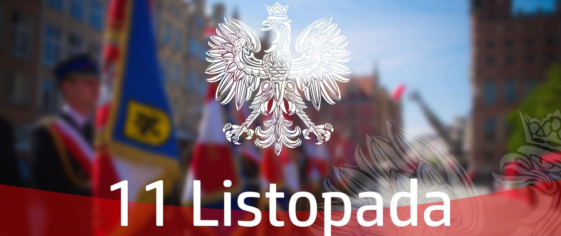 Godło Polski - biały orzeł, napis jedenasty listopada Narodowe Święto Niepodległości na tle rozmazanego zdjęcia.