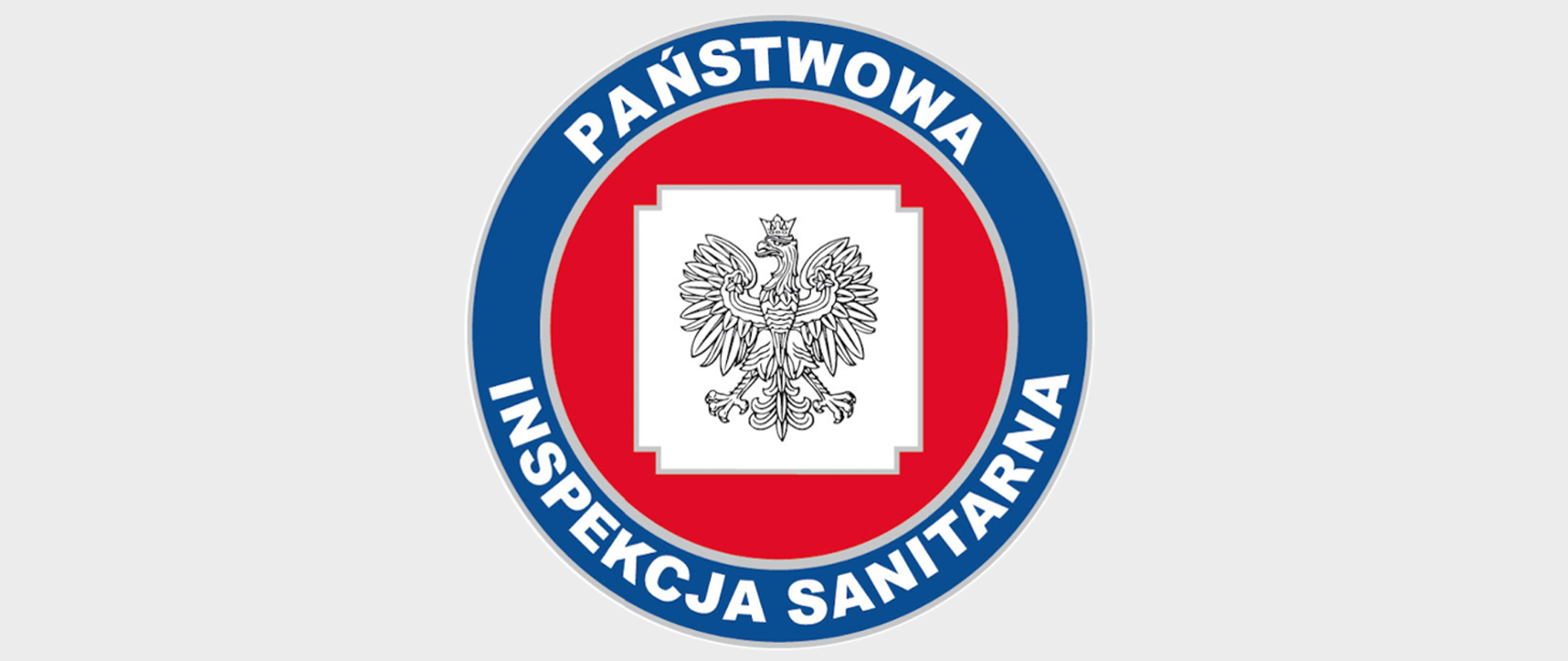 Logo Państwowej Inspekcji Sanitarnej - grafika przedstawia orła w koronie na białym tle, umieszczonym w czerwonym kole z niebieską oblamówką, na której widnieje napis "Państwowa Inspekcja Sanitarna"