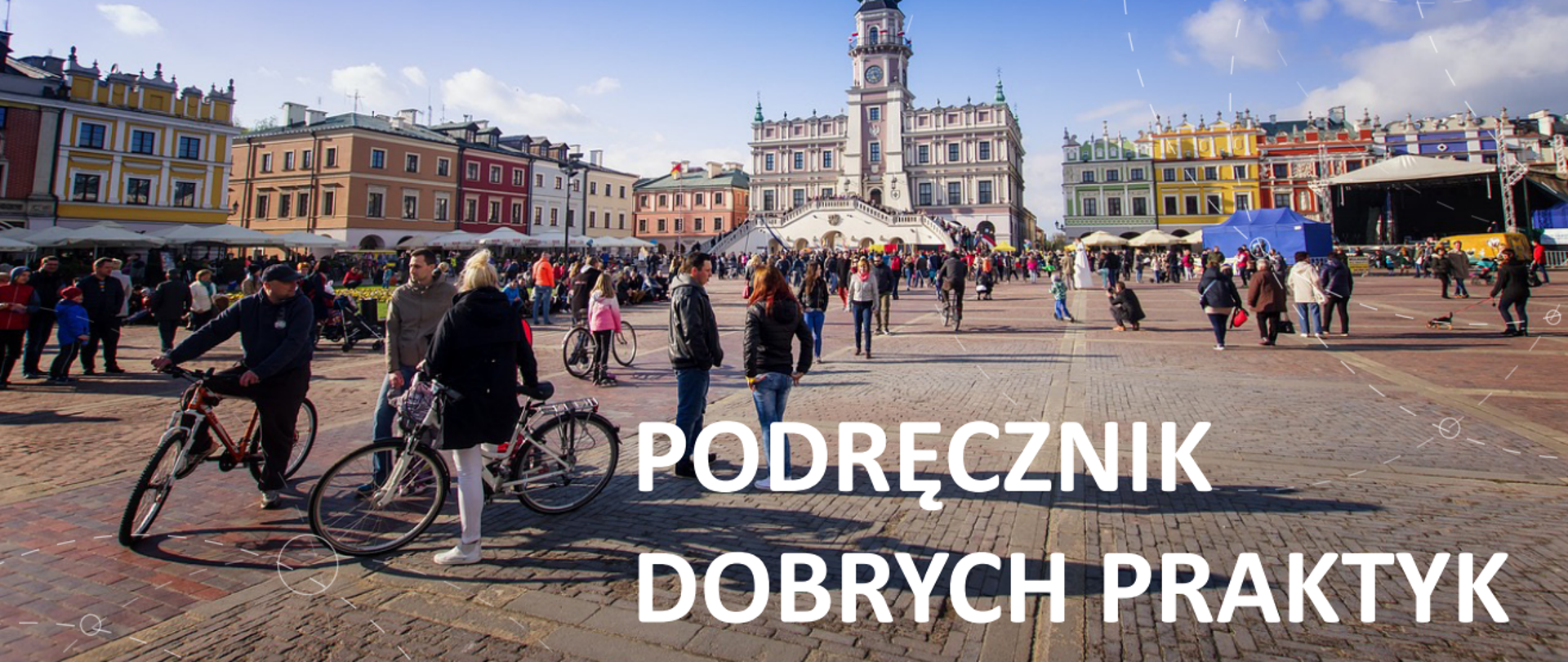 Na zdjęciu wydarzenie piknikowe na rynku miasta. Na pierwszym planie ludzie z rowerami.