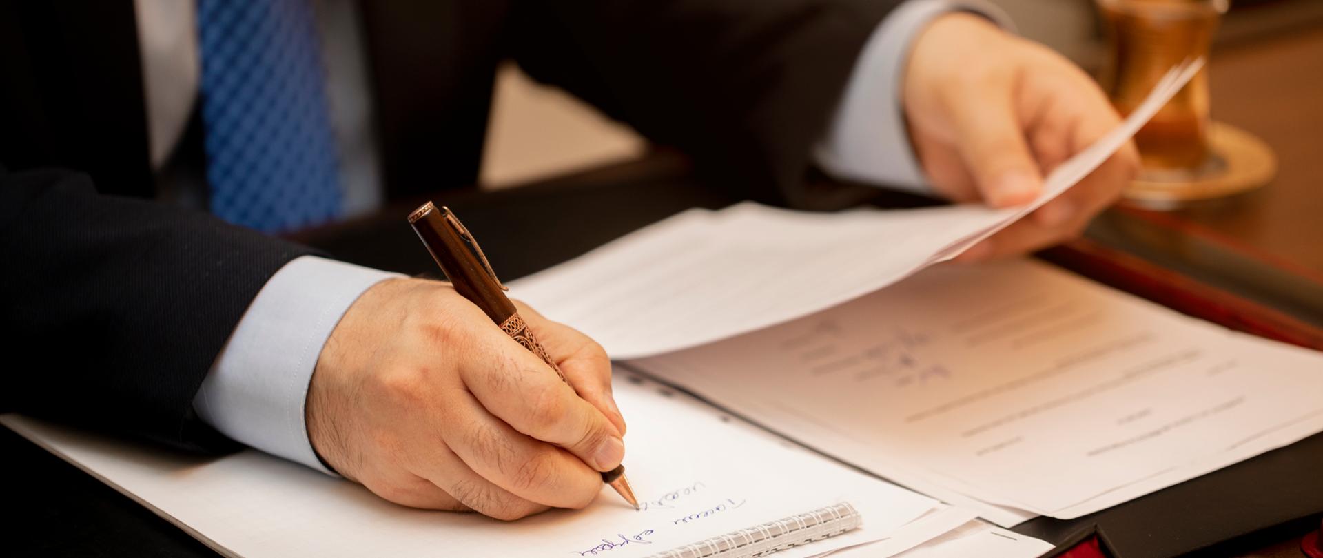 Businessman signing important contract papers. High quality photo