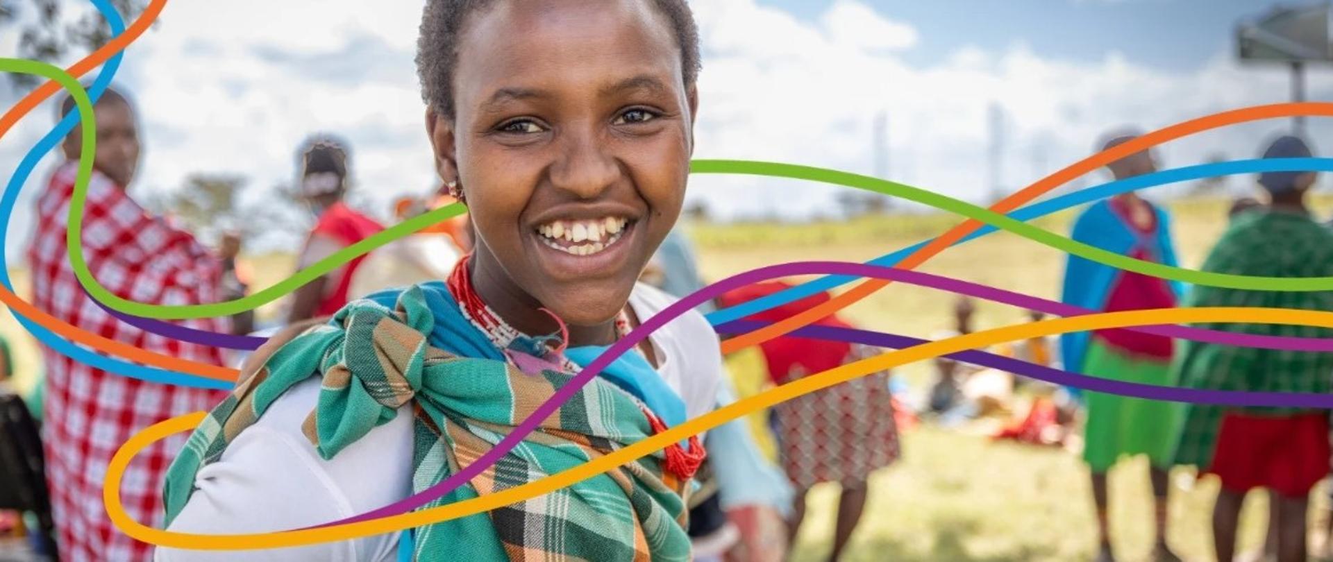 Razem dla zdrowia. Wspierajmy naukę. Uśmiechnięta dziewczynka na kolorowym tle.