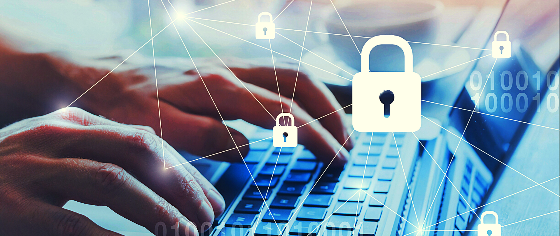 Ręce na klawiaturze, na pierwszym planie połączone liniami symbole kłódek.
