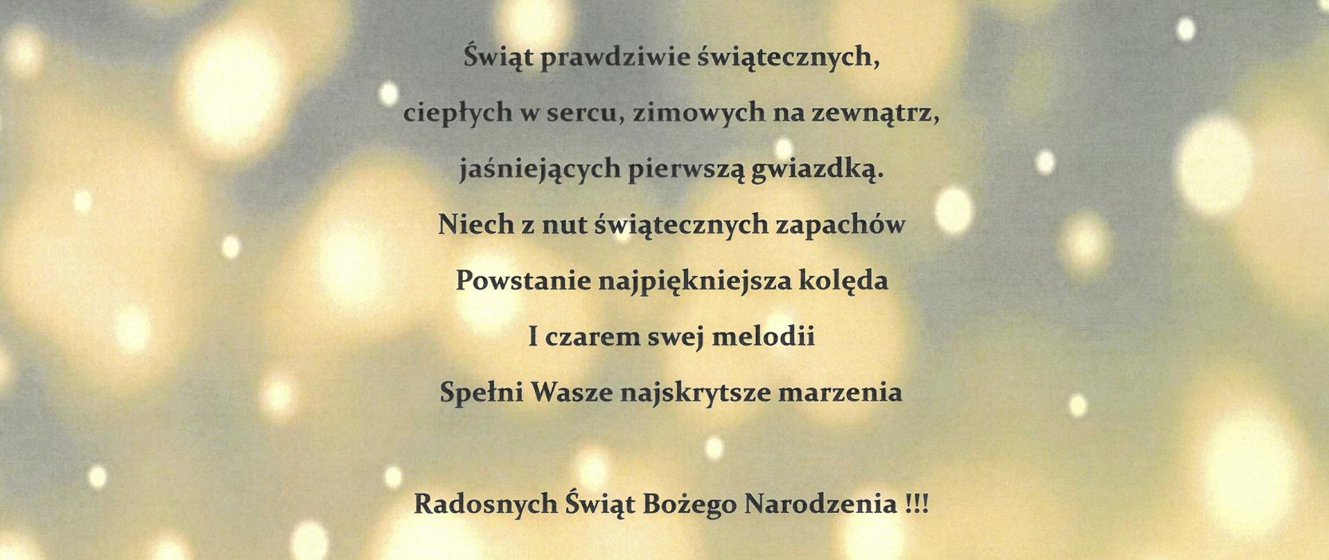 Kartka z życzeniami na Święta Bożego Narodzenia - tłem kartki z życzeniami jest ośnieżona choinka oraz snieżynki lecące z nieba, napisy w kolorze czarnym
