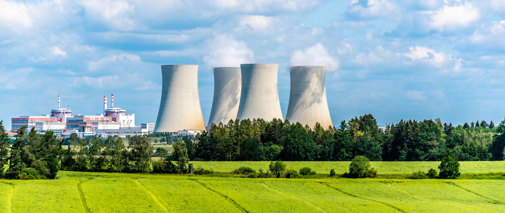 Nuclear power plant on the background of beautiful green summer meadow. Temelin, Czech Republic.